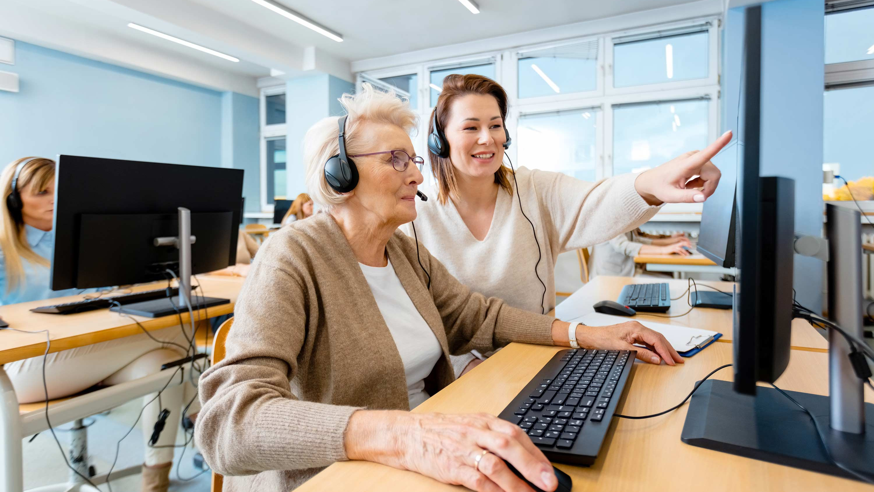 Two people learning together at a computer